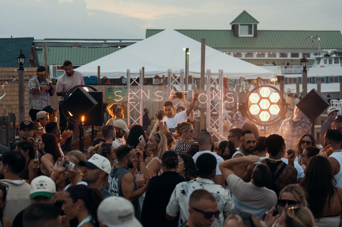 The crowd beneath the sign, Hideaway