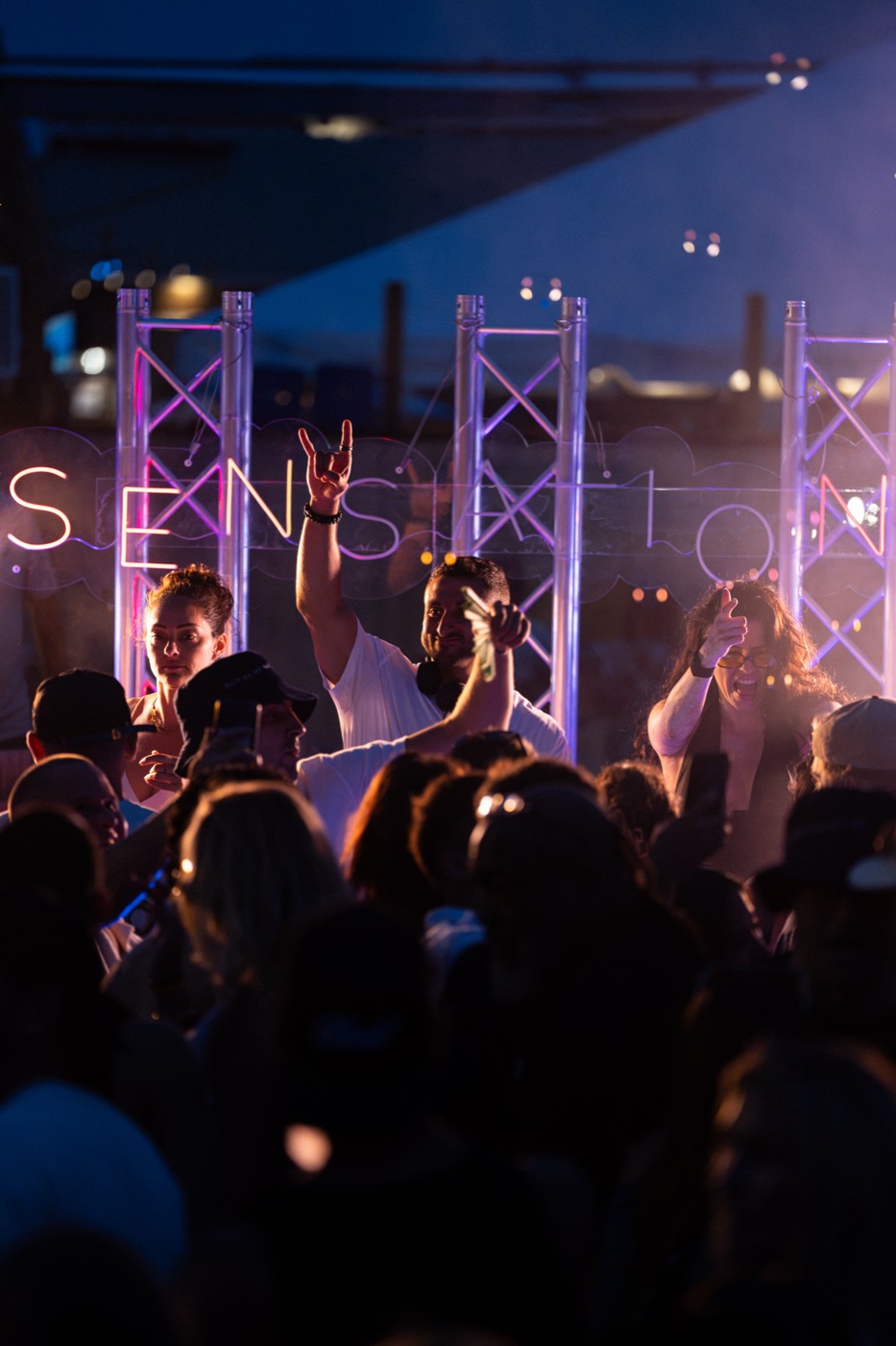 Hands up under the sign after dark, Hideaway